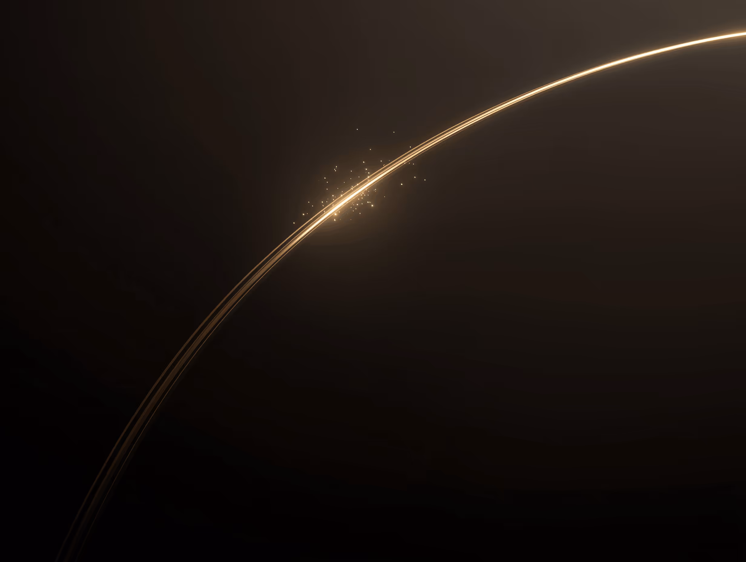 Orange crescent of light curving through darkness.